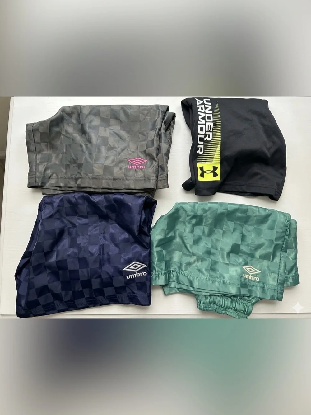 BUNDLE of 4 Umbro boys' athletic  shorts with a embossed retro checkered pattern
